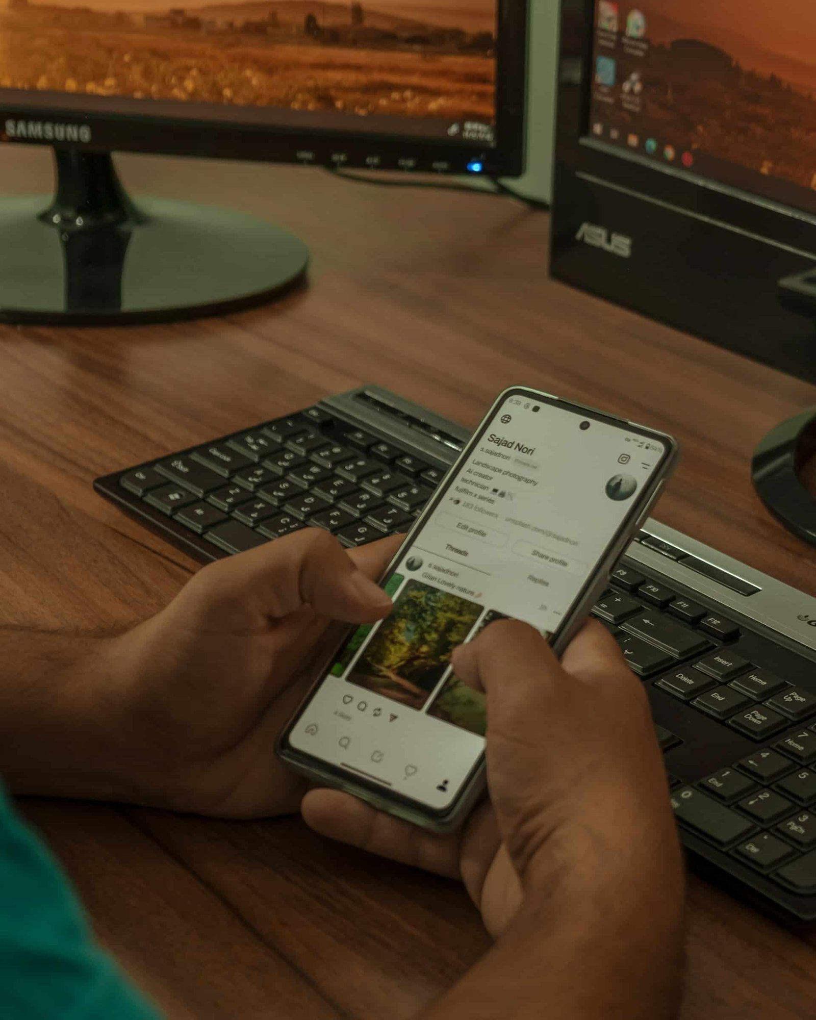 staff checking client social media on mobile phone